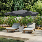 Dark grey patio umbrella with LED string lights over outdoor lounge chairs and table