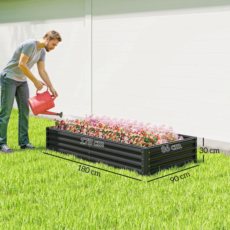 Dark grey galvanised steel planter filled with colorful flowers