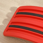 Red wobble board underside with black anti-slip strips on the base