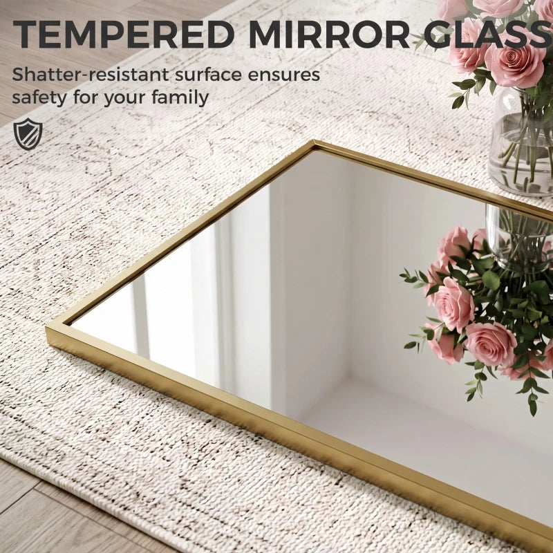 Gold-tone framed tempered-glass mirror, full-length rectangular shape.