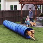 Blue dog agility tunnel across yard with ribbed fabric rings and open end