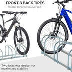 Silver bike parking rack with five U-shaped holders and two secured bicycles