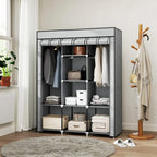 Light grey fabric wardrobe with shelves and hanging rails, fabric door open with storage inside.