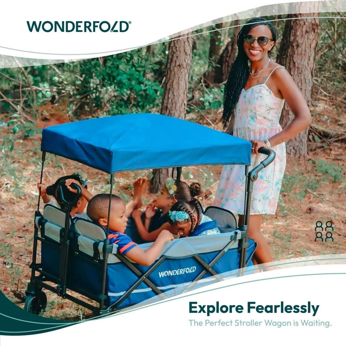 Sapphire navy quad stroller wagon with canopy carrying children outdoors