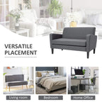 Charcoal grey loveseat sofa with curved arms and tapered wood legs