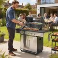 Silver BBQ grill with open lid and sausages cooking on the grates