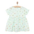 Light blue floral newborn dress with short sleeves and gathered skirt on wooden hanger
