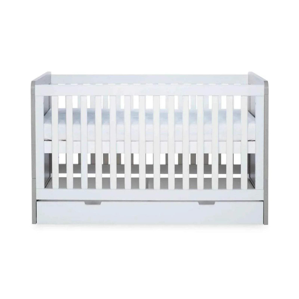 Close back view of ash grey and white baby cot with open front rail area