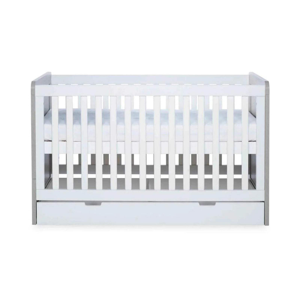 Ash grey and white cot bed back view with vertical safety rails