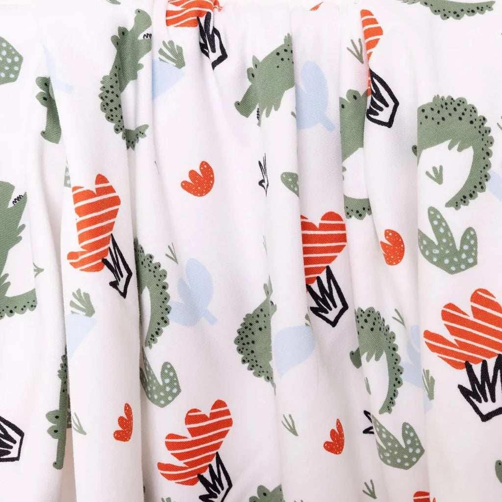 White kids blanket with loose drape showing repeating cactus, hearts, and arrows