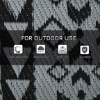 Reversible outdoor rug surface with black and grey diamond geometric pattern