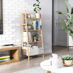Freestanding bamboo ladder shelf with four open tiers holding books and decor, natural wood
