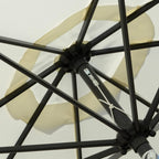 Close-up of black umbrella rib frame and central hub under a white canopy