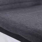 Grey chair seat with linen-touch fabric upholstery and dark metal base