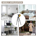 Tripod floor lamp with black stand and gold spotlight shade, full view
