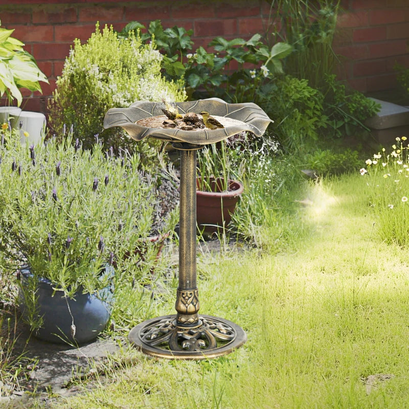 Bronze-tone standing bird bath with lotus leaf basin and bird perched on edge