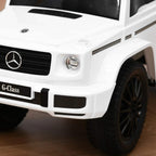 White kids ride-on car front with Mercedes-style grille, headlight, and black tires