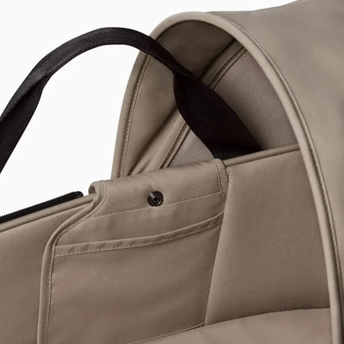 Taupe padded interior of newborn shell with front panel and carry handles