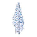 Blue muslin baby blanket with small fish and turtle print, draped fold design