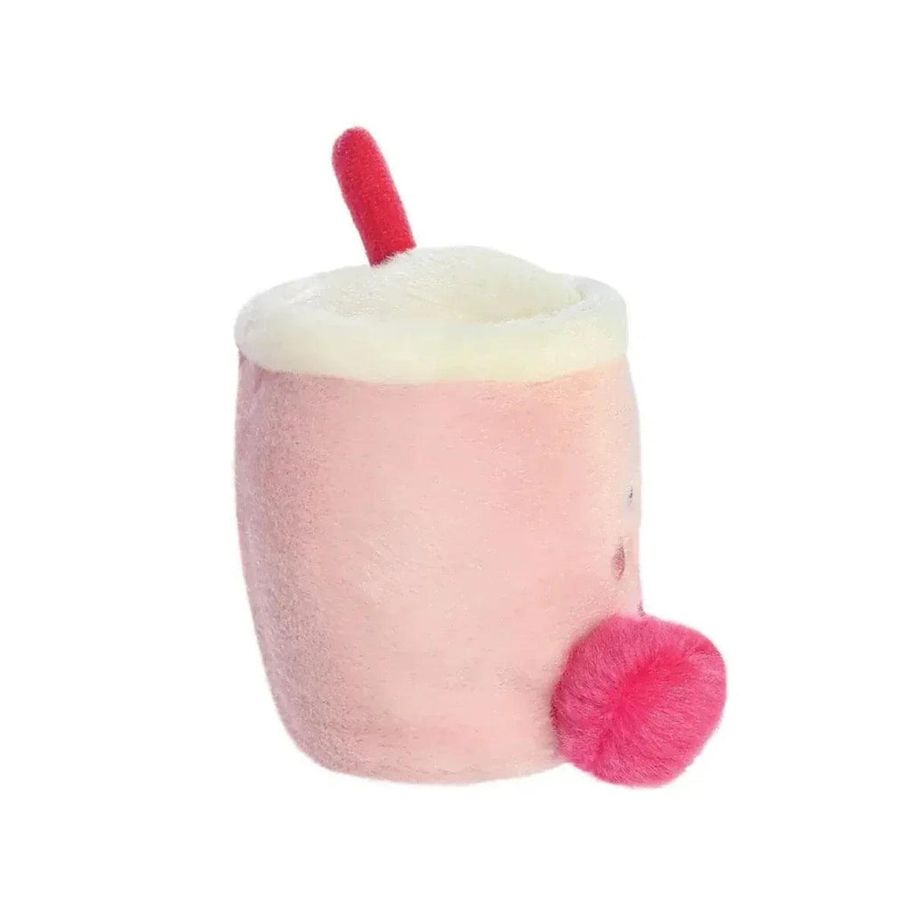 Pink plush boba cup toy with cream top, red straw, and side fuzzy pom-pom arm.