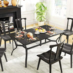 Black rectangular dining table with slatted tabletop and steel legs indoors