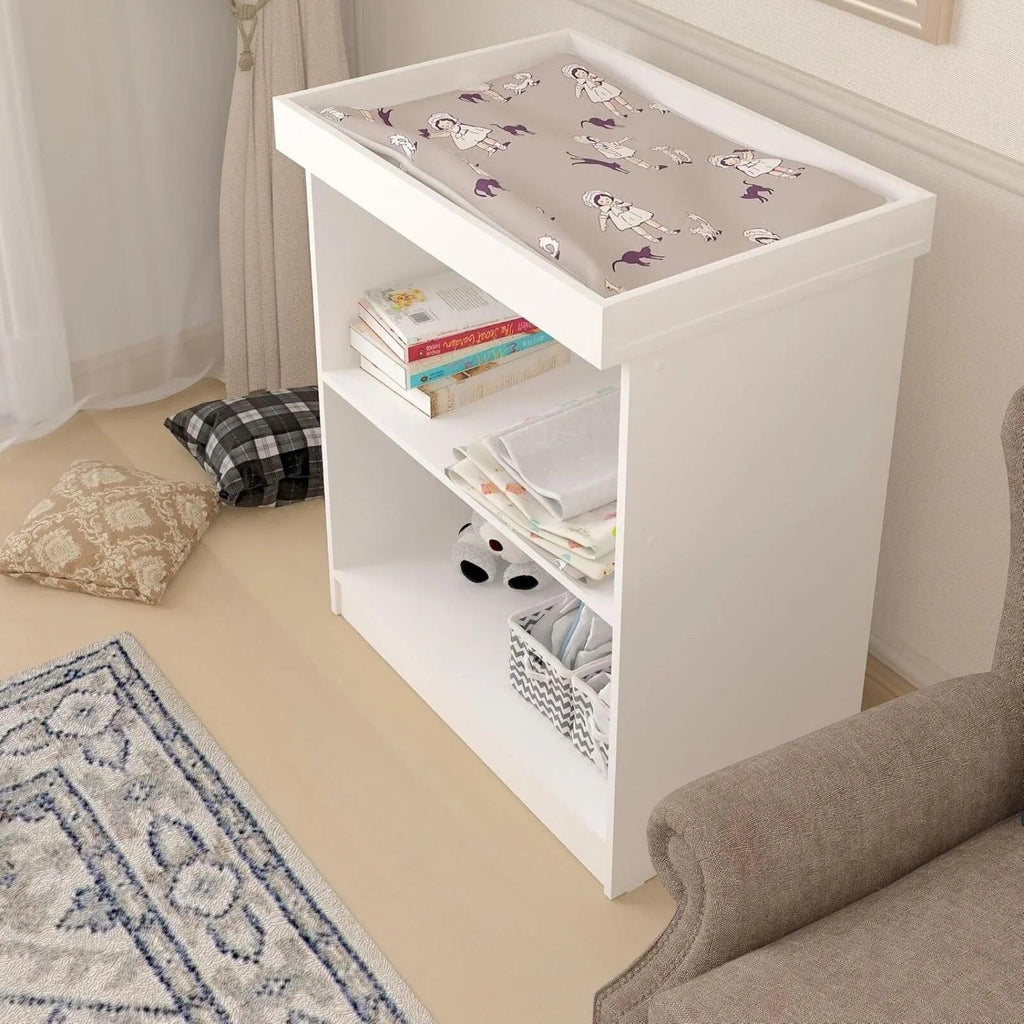 White changing table with patterned changing pad and two open storage cubbies