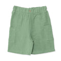 Muslin baby shorts in green with elastic waistband and side pockets