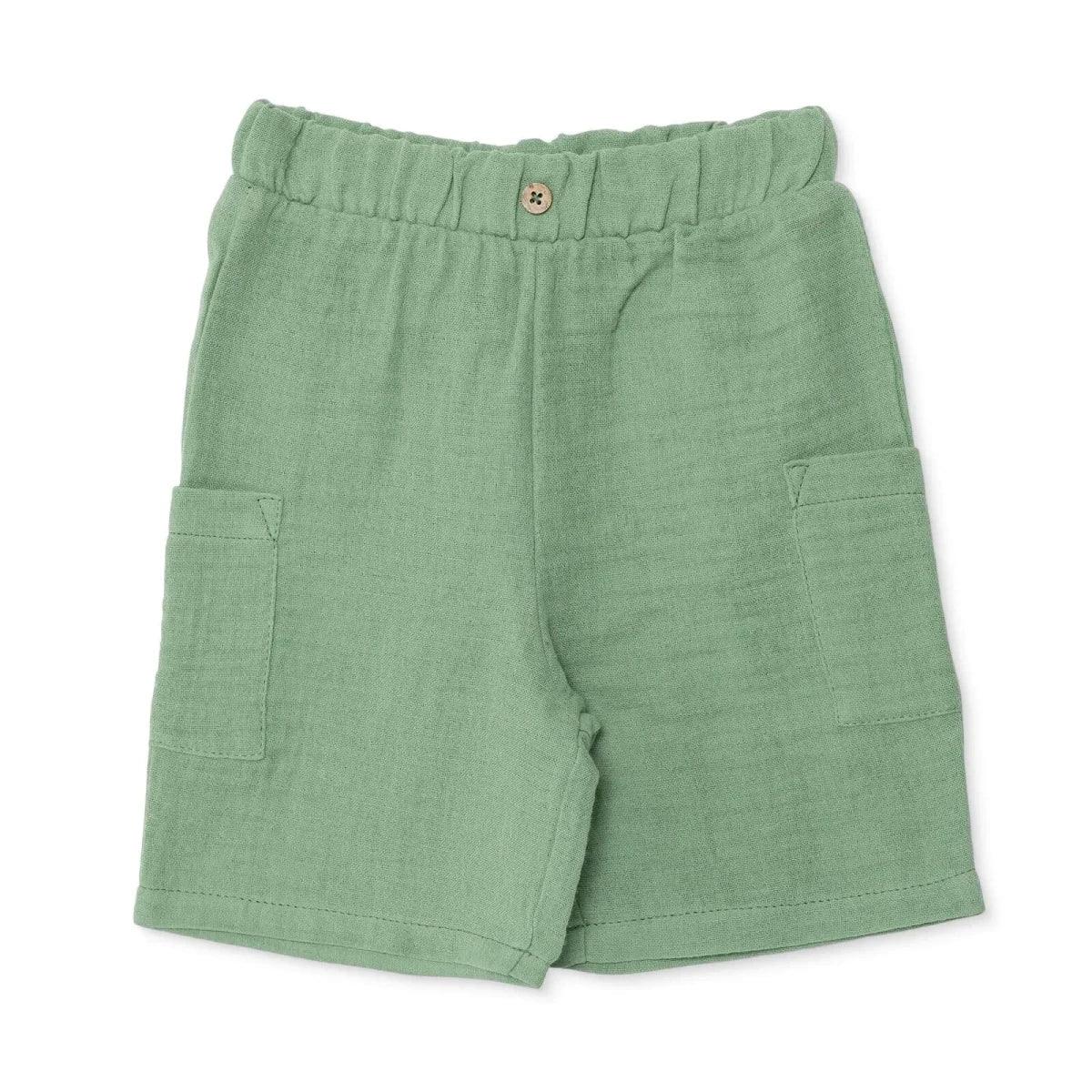 Muslin baby shorts in green with elastic waistband and side pockets