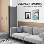 Dark grey folding room divider compact for storage, fully folded privacy screen