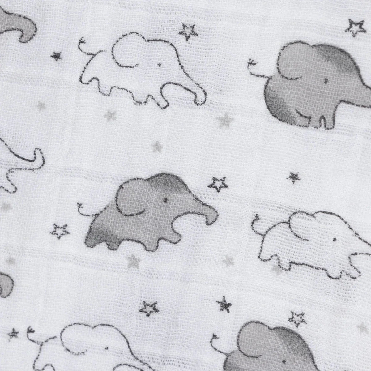White muslin fabric close-up with gray elephant figures and small star specks