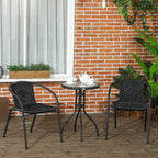 Black rattan bistro set: two armchairs and a round glass-top table on outdoor patio