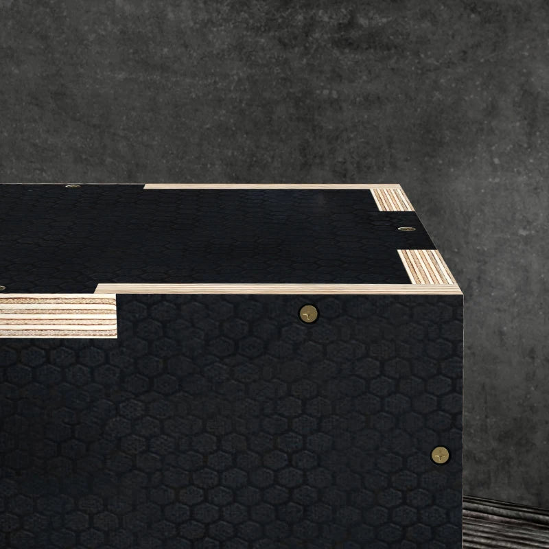Top view of black wooden jump box platform with light wood support strips