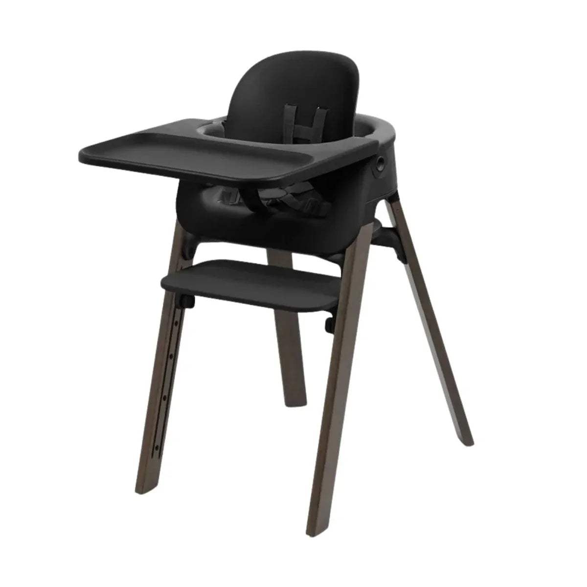 Black highchair with rounded backrest, black tray, and warm brown wooden legs