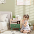 Kids bedside table with green drawer and open shelf, light wood frame and legs