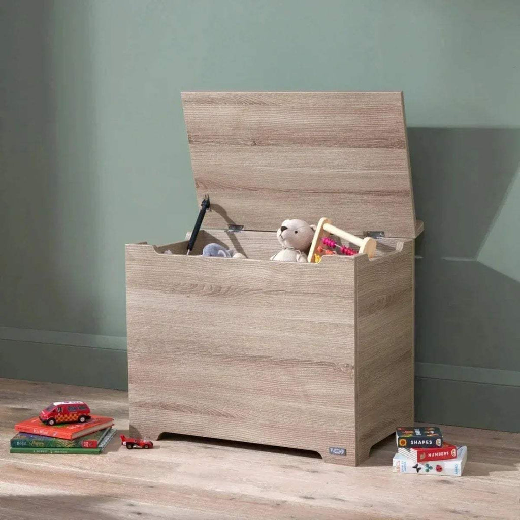 Oak wooden toy box with lid open, showing toys inside
