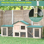 Wooden guinea pig hutch with green roofs, wire mesh doors, and covered front opening