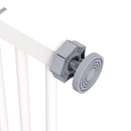 Close-up of white safety gate pressure-mount screw and bracket hardware