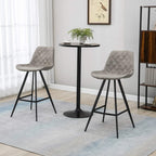 Set of 2 grey quilted bar stools with curved seats, padded back, steel frame, footrest