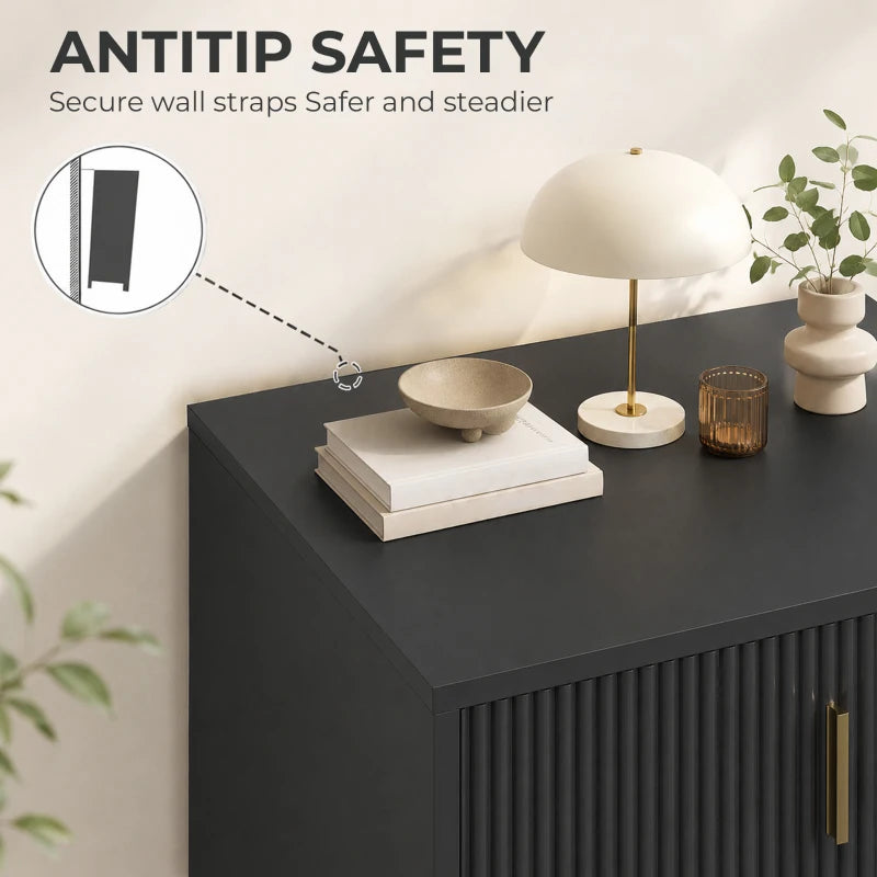 Black dresser corner with flat top and gold bar handle, shown with anti-tip strap.