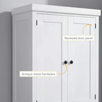White cabinet door with recessed panel and antique metal knobs, close-up detail
