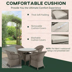 Grey cushioned PE rattan outdoor dining chairs around a round table