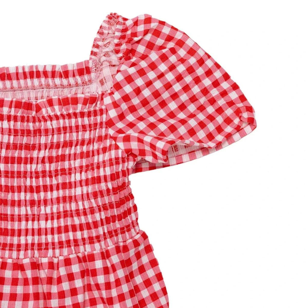 Pink gingham baby dress sleeve detail with elastic smocking and puffed short cuff