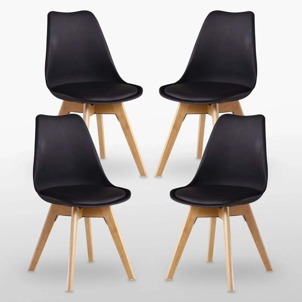 Set of 4 black upholstered dining chairs with curved backs and light wood tapered legs