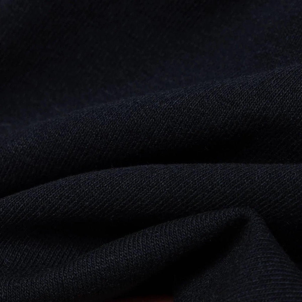 Black jersey fabric detail with soft knit texture and close weave