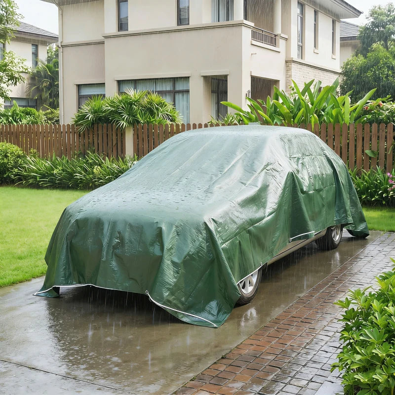 Green waterproof tarpaulin car cover with secured lower edge and grommet corners
