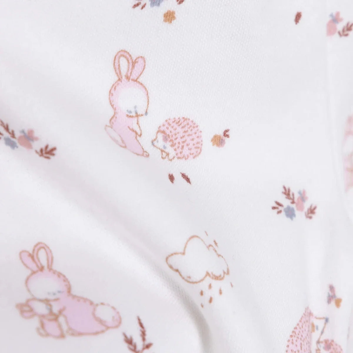 Ecru fabric detail of pink bunny and hedgehog print on pajama pants