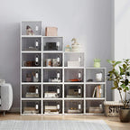 Stackable clear shoe storage boxes with magnetic doors, some containing shoes.