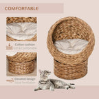 Brown wicker cat bed basket with beige cushion and round dome opening