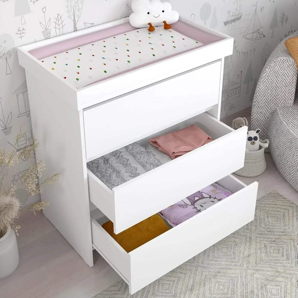 White baby changing unit with raised changing surface and two storage compartments