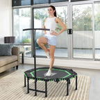 Mini fitness rebounder trampoline with padded mat and green bungee cords, shown outdoors